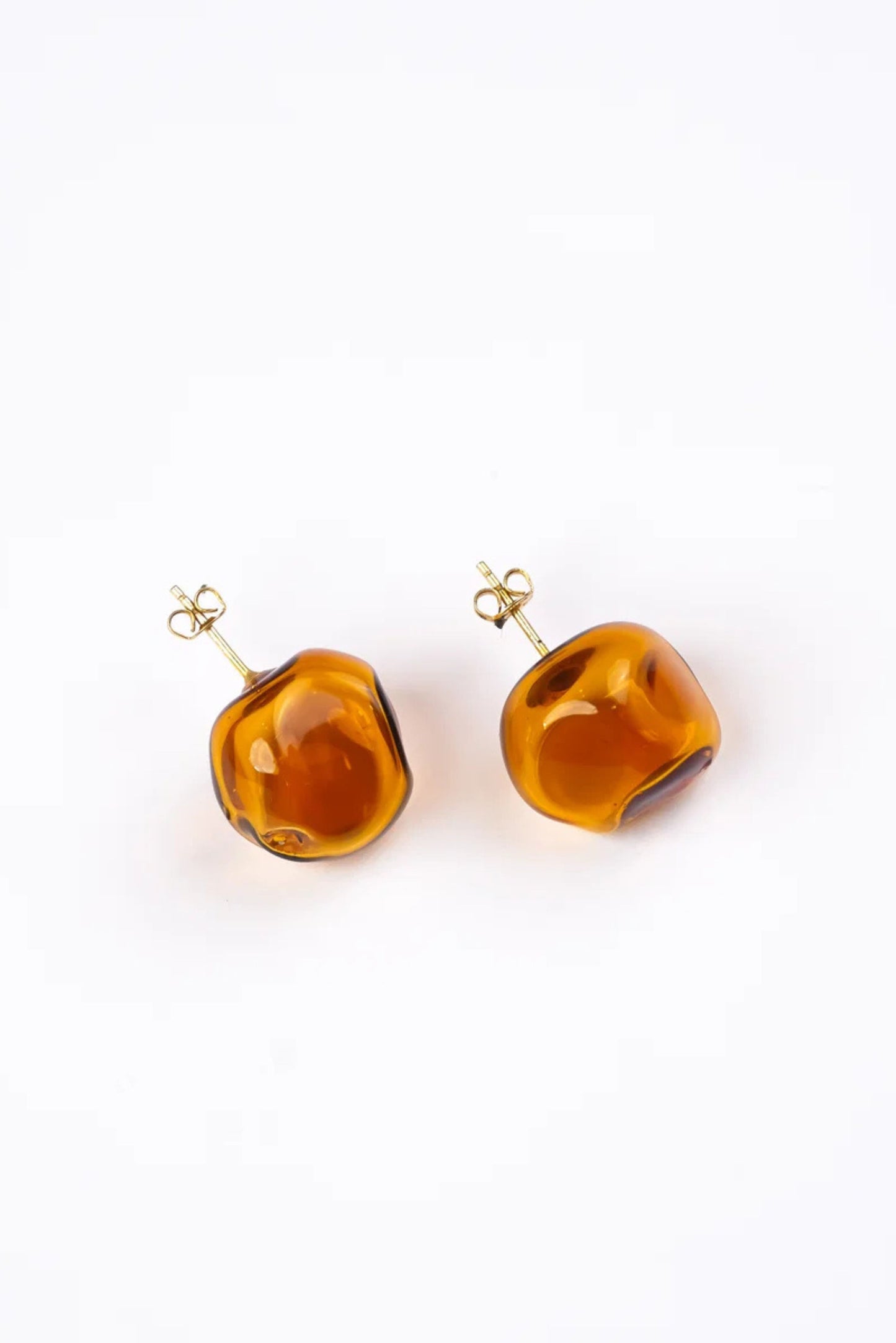 Amorphous Studs in Amber