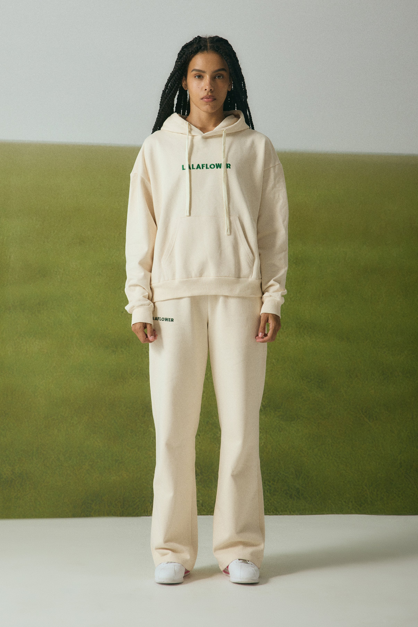 OFF-WHITE SWEATPANTS WITH GREEN EMBROIDERY