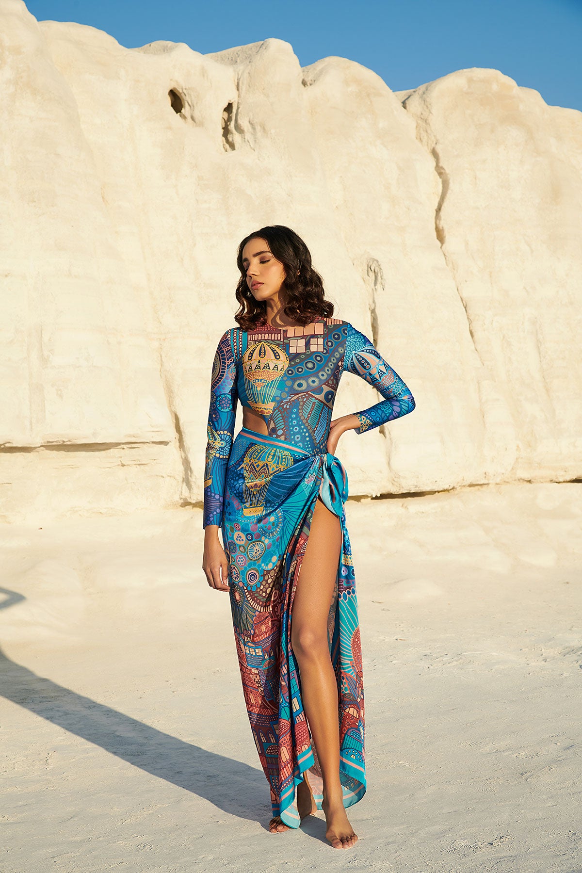 Long-Sleeved Halo Swimsuit paired with Beach Bum Sarong in - CAPPADOCIA